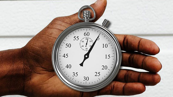 Photo of stopwatch in a man's hand